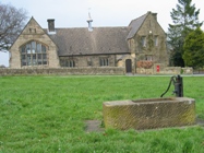 Brackenfield Church Hall on Brackenfield Green with pump