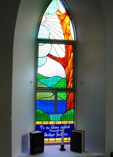 A modern stained glass window inside St Mark's Handley